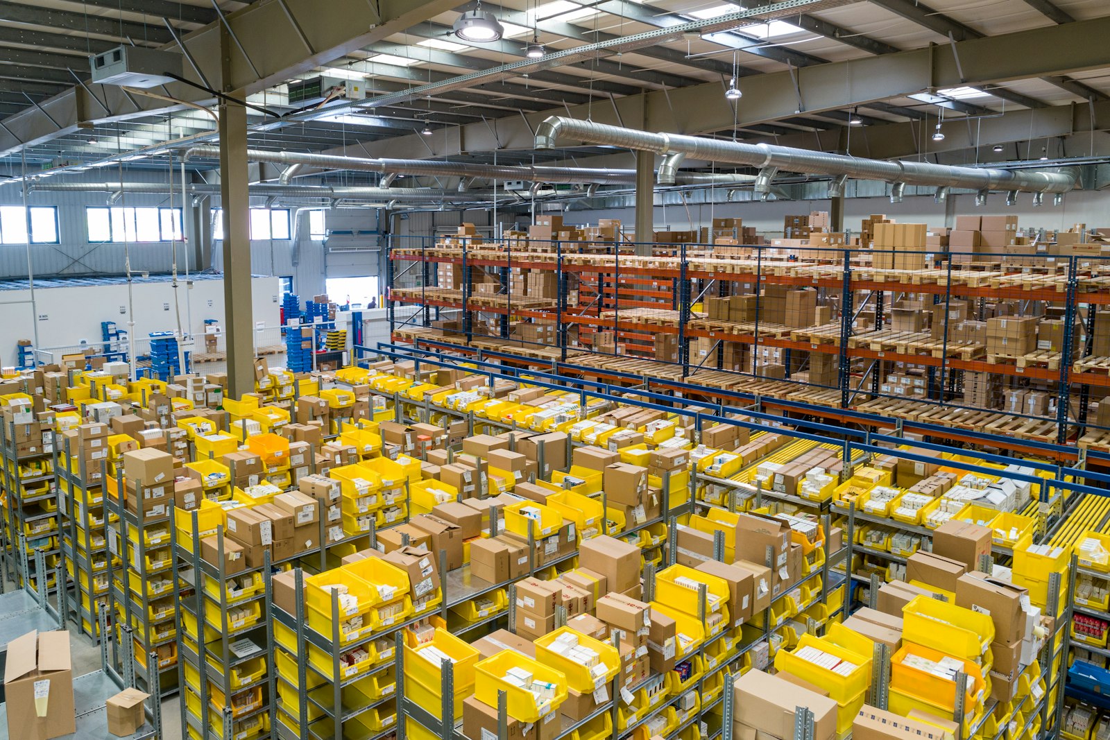 Forklift moving freight inside a modern warehouse